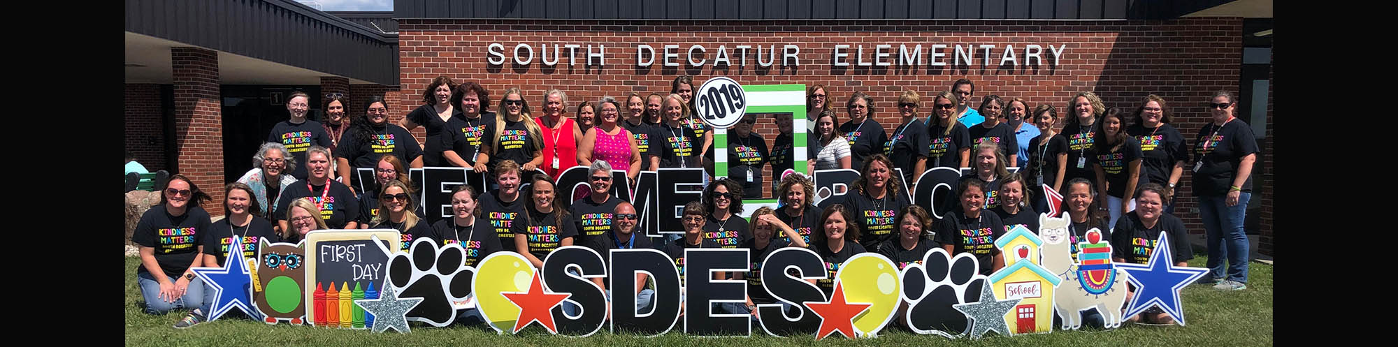 South Decatur Elementary friendly staff in front of their school building