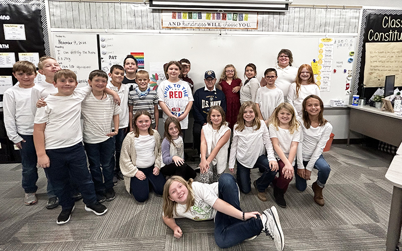 Group of students in the classroom wearing white t-shirts